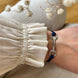Equestrian Jewelry armband Sam: satijnen koord met een bit bezet met strass-steentjes, in goud of zilver