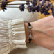Equestrian Jewelry armband Sam: satijnen koord met een bit bezet met strass-steentjes, in goud of zilver