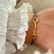 Equestrian Jewelry armband Lana: dun elastisch koordje met een fijne bit in goud of zilver