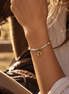 Equestrian Jewelry armband Azur met kleine facetgeslepen natuursteentjes en een hoefijzer in het midden