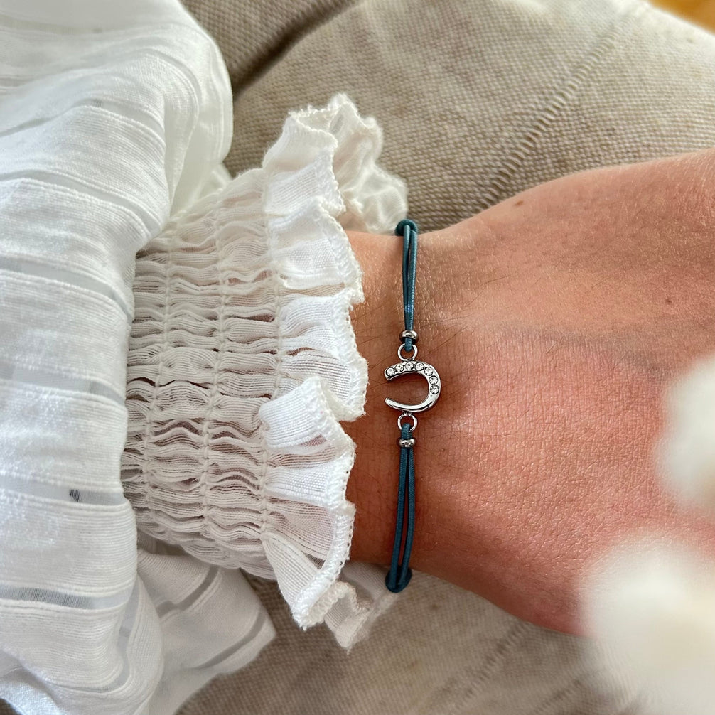 Equestrian Jewelry armband Lola: klein hoefijzer met strass-steentjes op een gekleurd koordje, in goud of zilver
