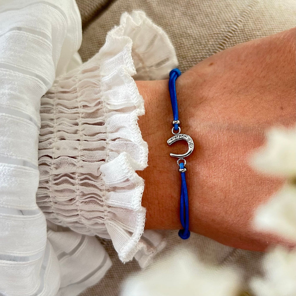Equestrian Jewelry armband Lola: klein hoefijzer met strass-steentjes op een gekleurd koordje, in goud of zilver