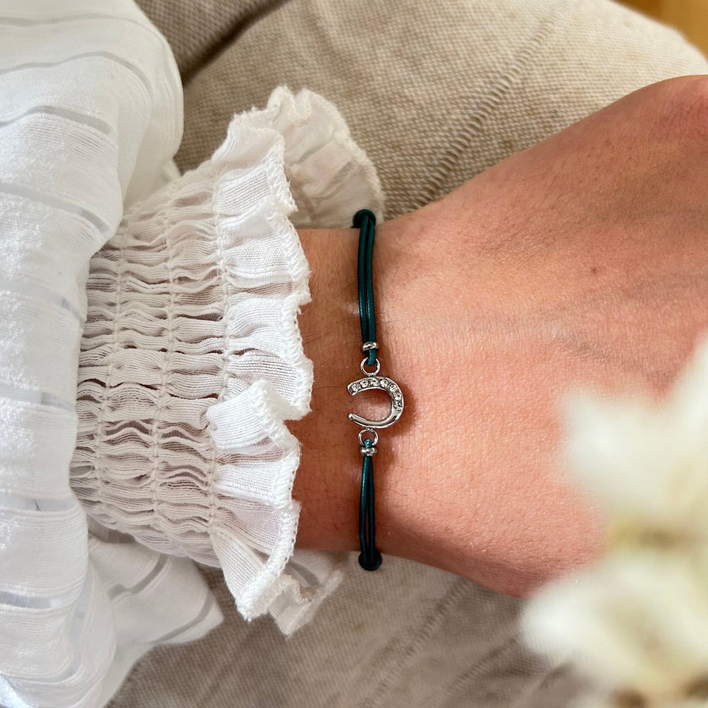 Equestrian Jewelry armband Lola: klein hoefijzer met strass-steentjes op een gekleurd koordje, in goud of zilver