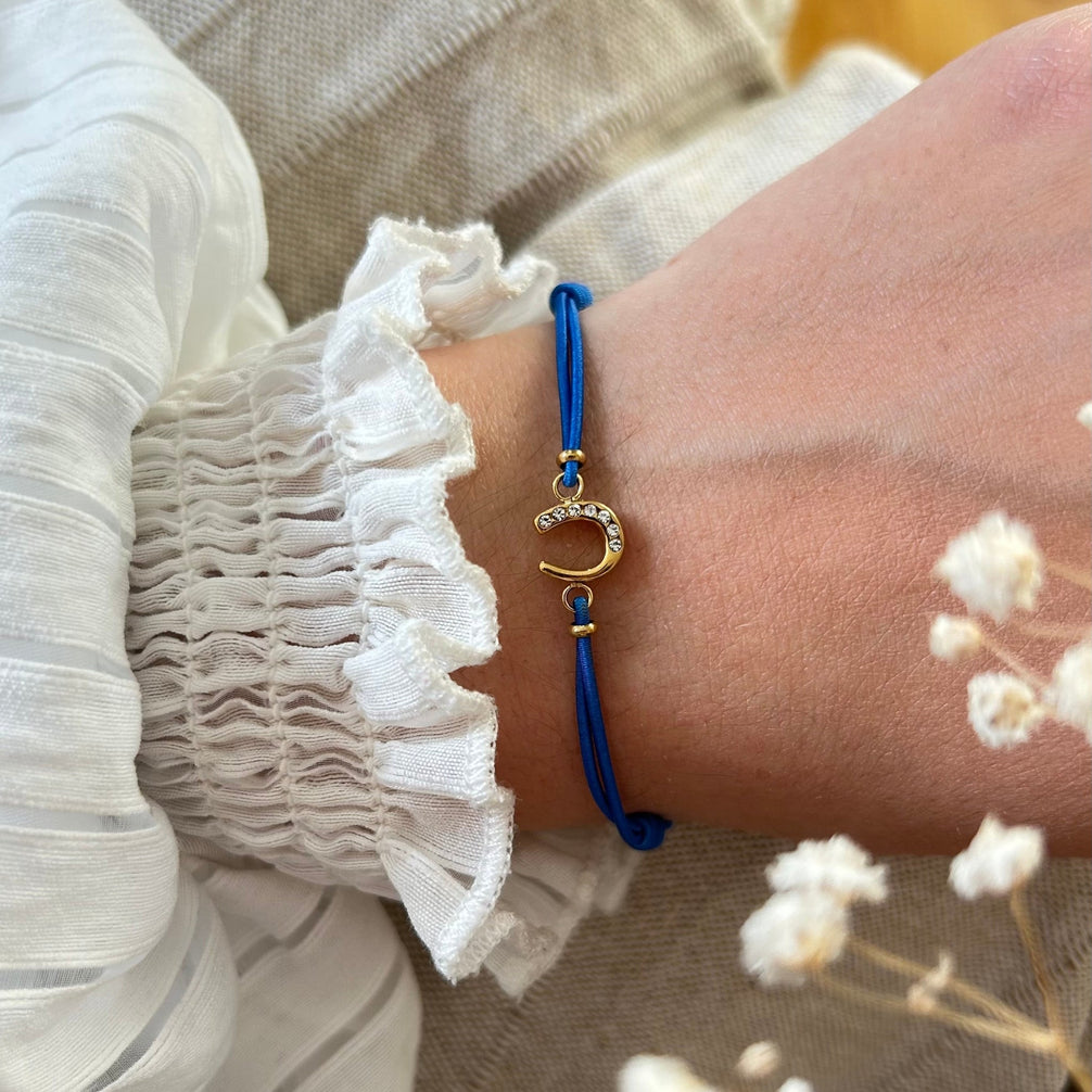 Equestrian Jewelry armband Lola: klein hoefijzer met strass-steentjes op een gekleurd koordje, in goud of zilver