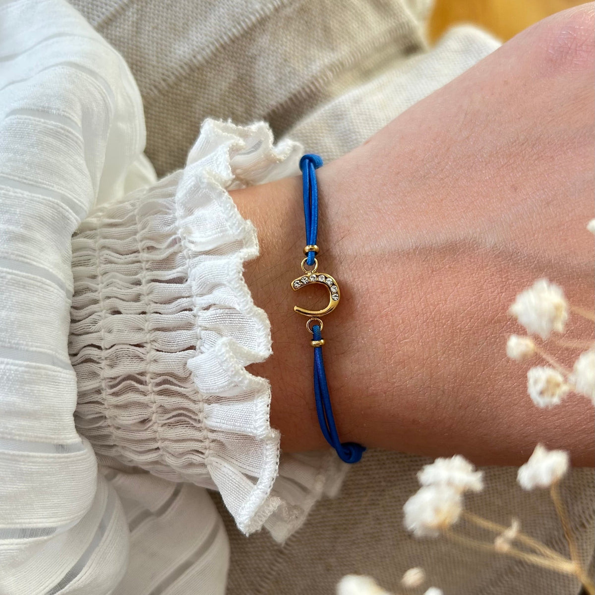 Equestrian Jewelry armband Lola: klein hoefijzer met strass-steentjes op een gekleurd koordje, in goud of zilver