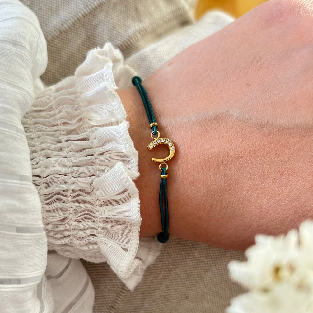 Equestrian Jewelry armband Lola: klein hoefijzer met strass-steentjes op een gekleurd koordje, in goud of zilver